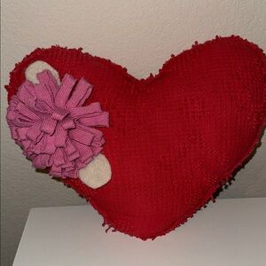 Red Heart-Shaped Pillow with Pink Flower Accent